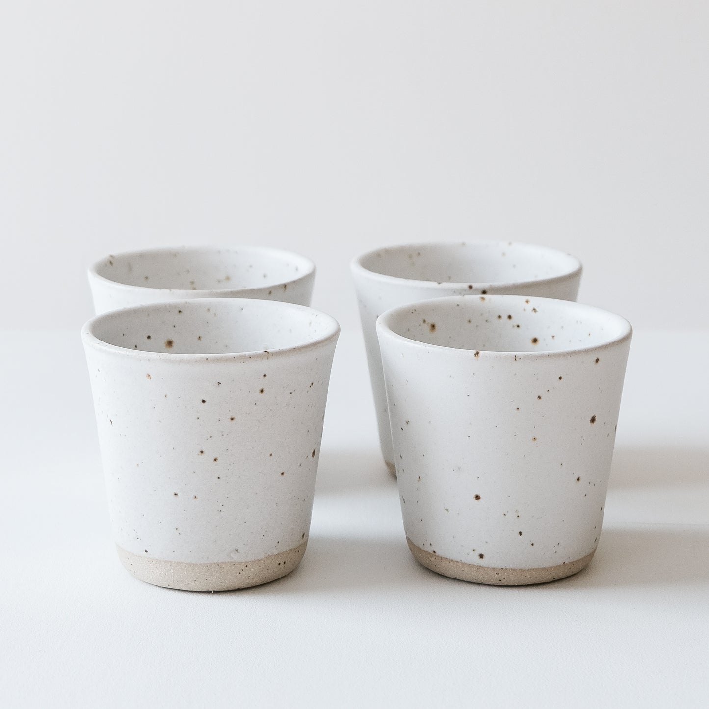Matte White & Speckled Beakers - Set of 4 SECONDS - DOR & TAN